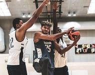 Princepal Singh tries to score while being heavily guarded